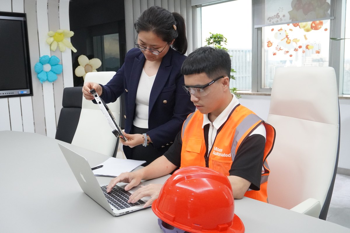 Apter Power team inspecting an industrial automation component